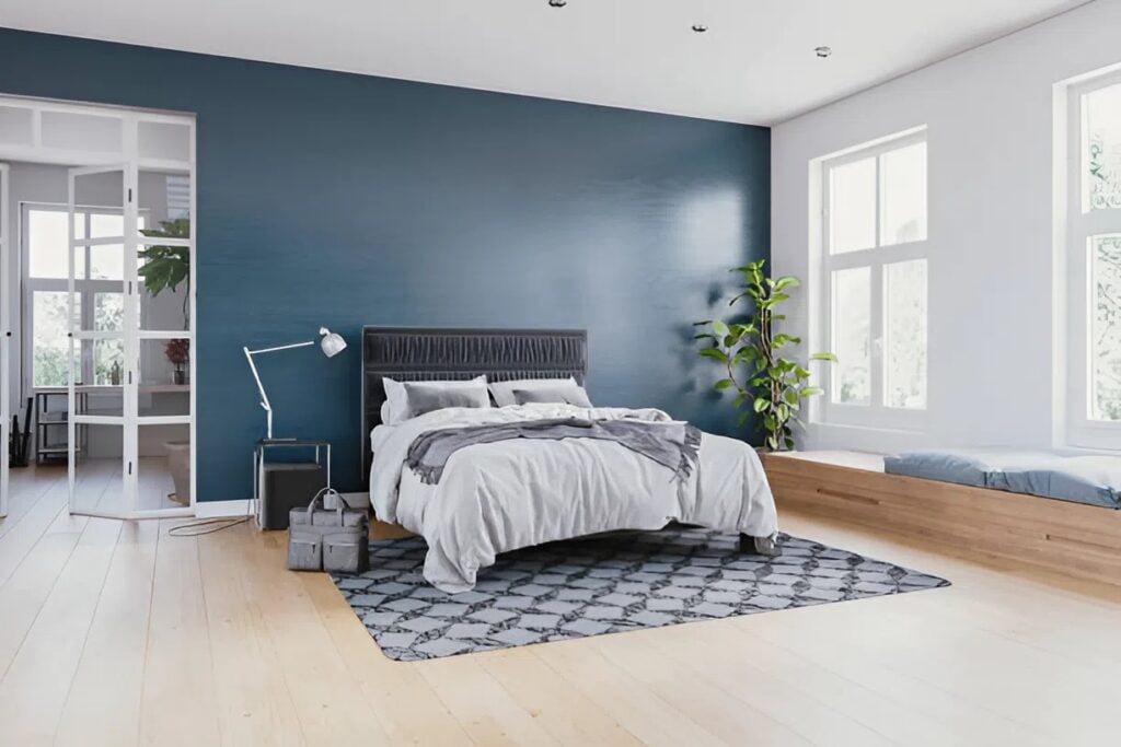 Bedroom interior with a blue accent wall painted by a house painter in Grants Pass, OR