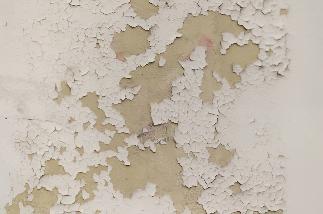 Peeling and cracking wall paint showing signs a home needs an exterior painter in Central Point, OR