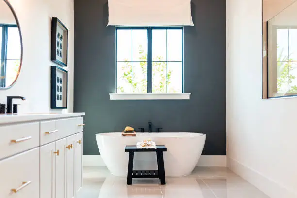 Bathroom with charcoal gray walls and satin finishes by an interior painter in Medford, OR