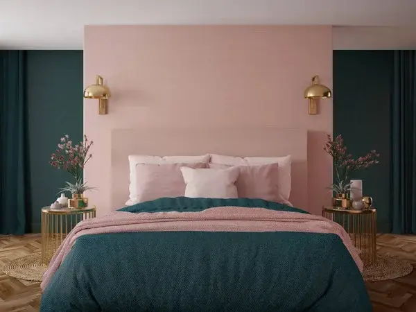 Bedroom with dusty pink walls and deep teal accent walls by a house painter in Gold Hill, OR.
