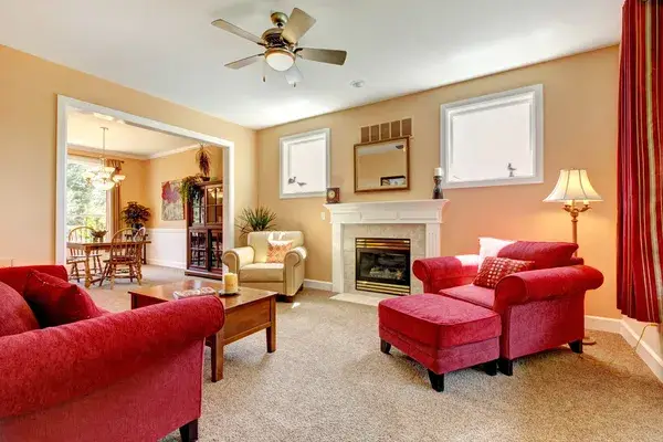 Living room with soft beige wall colors and crisp white trim by a house painter in Gold Hill, OR.